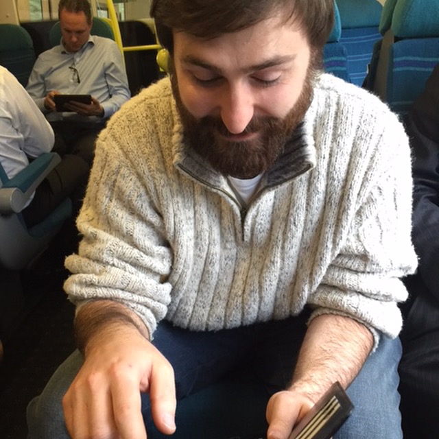 Charles Parkes looking at new iphone 6 plus bought for promoting the Aegis Saga on social media